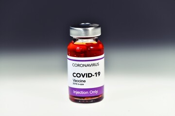 Wrong vaccination treatment Covid-19 Coronavirus COVID 19 virus. The last bottle left. Toxic red liquid. Concept of error and adverse reactions for herd immunity