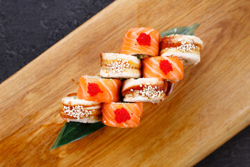 Seafood delicatessen sushi rolls set on board