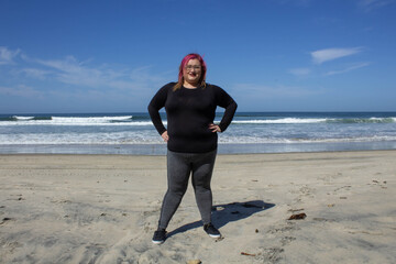 fat woman wearing sportswear training on the beach to lose weight, healthy lifestyle