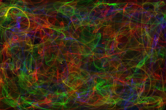 green and red smokey lines on a black background color mix