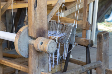 vintage weaving mechanism with stretched threads close up