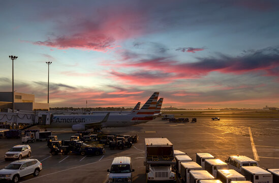 Planes departing from Boston Logan Airport at sunset