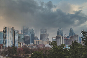 Fototapeta premium Philadelphia, PA - March 26 2021: Skyline of Philadelphia on a cloudy, stormy and foggy day