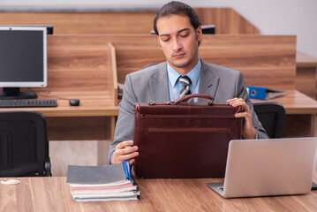Young male employee working in the office