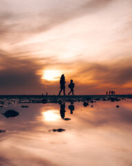 Silhouette of person at sunset on the beach