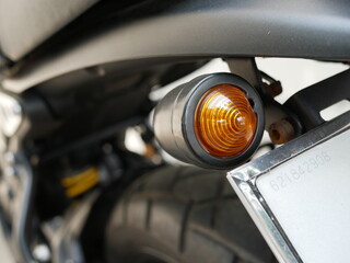 closeup of motorcycle turn signal light.