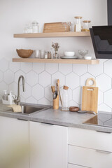 Fototapeta na wymiar Empty modern kitchen interior white cosiness apartment cuisine design domestic furniture equipment
