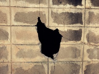 Vintage wall hole in the concrete, the conceptual background