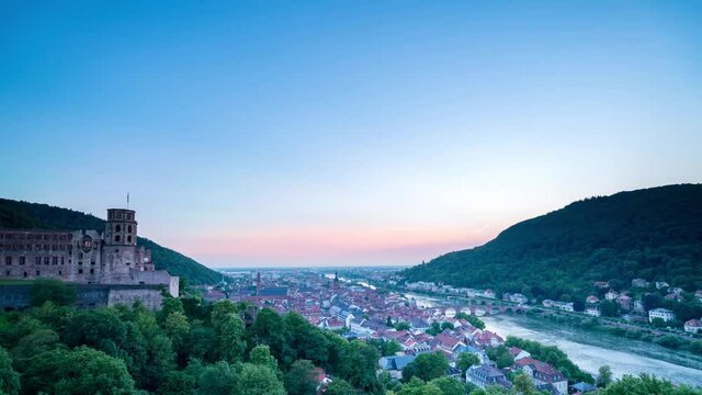 A day to night time lapse of the city near Heidelberg Castle and the river Neckar in Germany