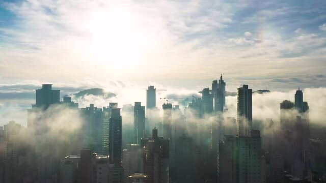 Aerial view of mist covering the city of Bal. Camboriú early morning, Brazil