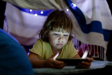 bored girl at home watching cell phone 