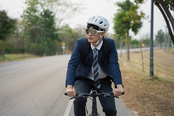 Asian men ride bicycles to work