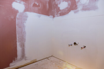 Remodeling renovation in bathroom with patching drywall