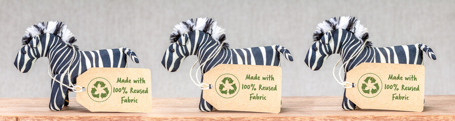 Zebra toys with Made with 100 percent reused fabric label and recycle textiles icon symbol