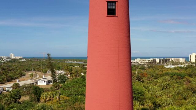 Aerial rise reveal Jupiter Lighthouse Florida historic landmark