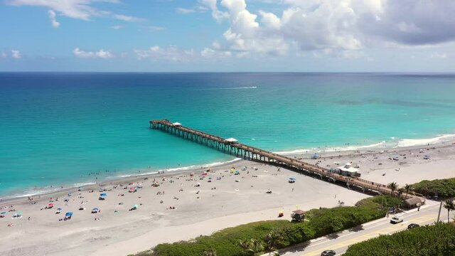 Juno Beach fishing pier aerial drone clip