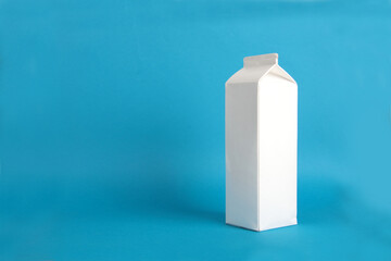 white cardboard pack isolated on blue background