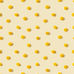 Mimosa flower is pattern of round fluffy yellow balls. Geometric polka dot pattern made of natural flowers. Minimal abstract background