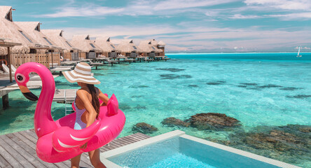Travel vacation fun tourist woman enjoying luxury summer holidays at Bora Bora overwater bungalow...