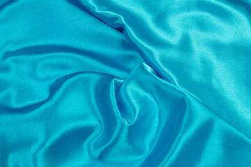 Fabric satin silk drapery. Blue textile	