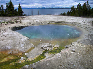 The prismatic colors of Surging Spring in the West Thumb Geyser Basin on the shore of Yellowstone Lake Yellowstone National Park Wyoming USA 2005