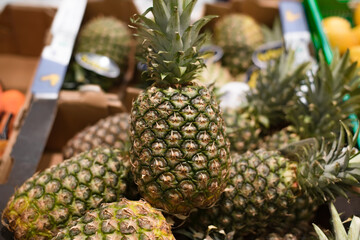 Pineapples in the store, close-up. Selective soft focus