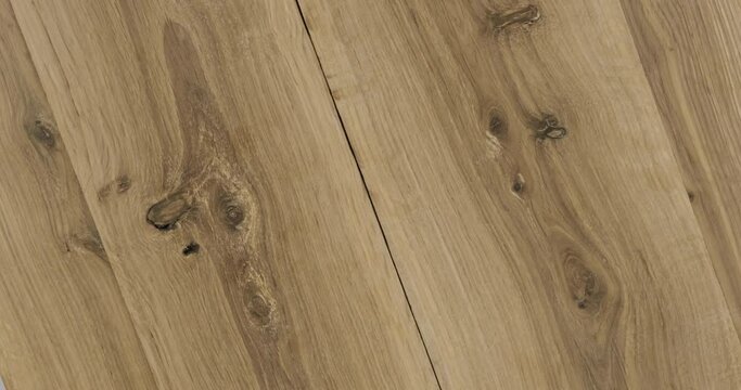 Zoom and rotation. Top view of natural oak boards. Oak texture with cracks and wood knots.