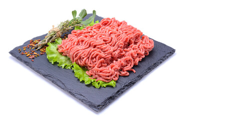 Fresh minced pork and beef and spices on a slate stone.Isolated on a white background, selective focus. horizontal view.