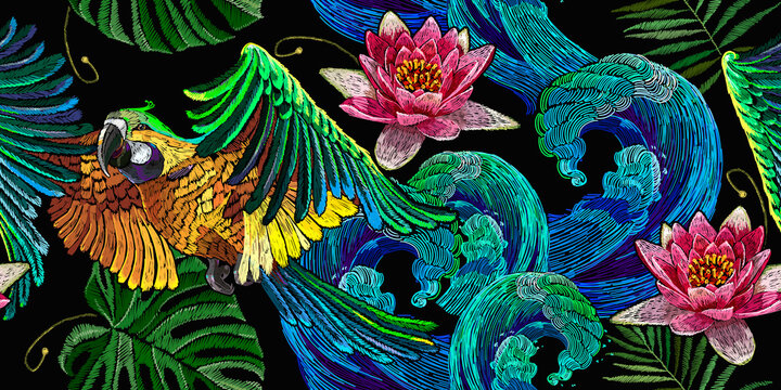Colorful flying ara parrots, palm leaves, sea waves and pink lotus flowers seamless pattern. Macaws. Fashionable template for design of clothes, textiles. Magic romantic tropical background