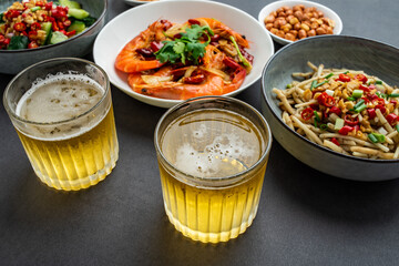 A table of Chinese home cooking and beer