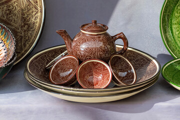 Holiday Navruz. National traditional dishes of Crimean Tatar. Traditional painted ornaments on household. 