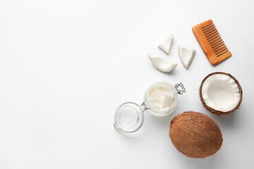 Jar with coconut oil and brush on white background