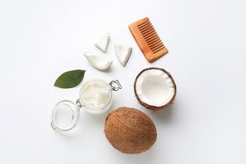 Jar with coconut oil and brush on white background