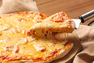 Tasty pizza on wooden background, closeup