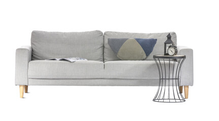 Stylish sofa with table on white background