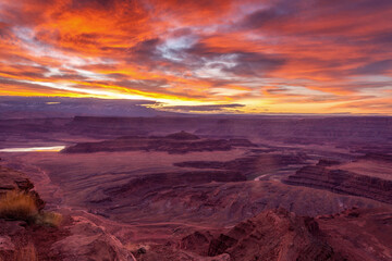 Fototapeta na wymiar Dramatic skies over sunrise at Dead Horse Point State Park near Moab, Utah