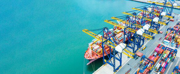 Aerial top view Cargo operations on container ship in port. Business logistic commercial intermodal...