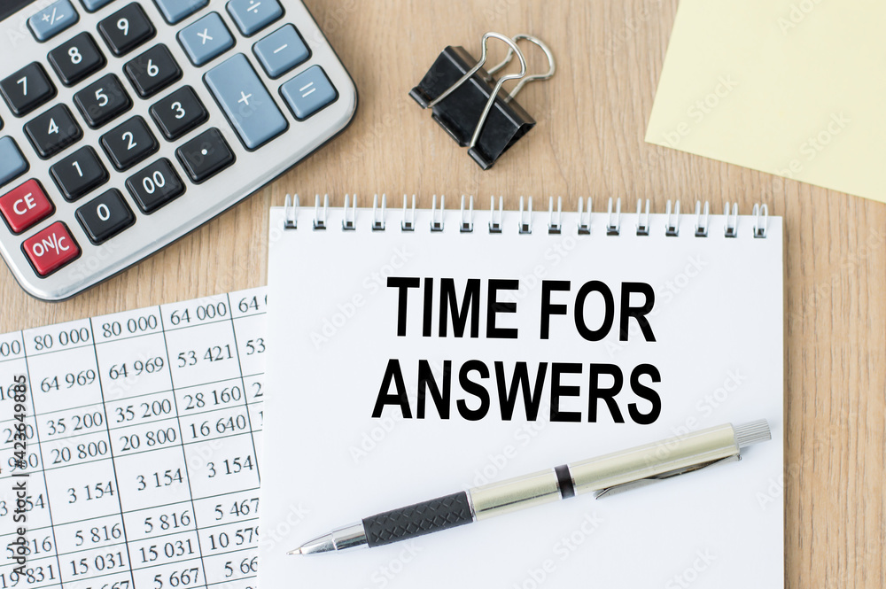 Poster notebook with the text time for answers on the office table