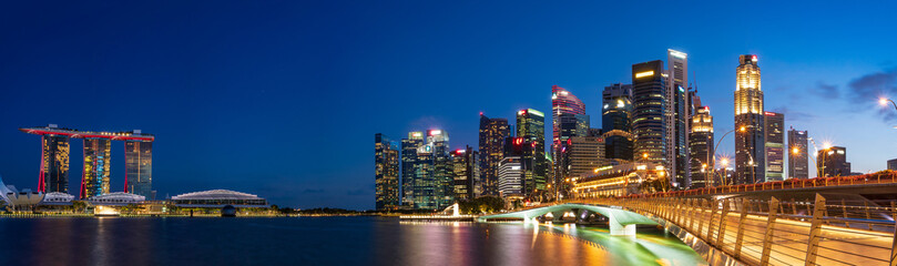 Fototapeta na wymiar Ultra wide panorama of City scape of Singapore central area at magic hour.