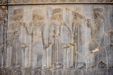Relief depicting human figures at the ruins of Persepolis in Iran