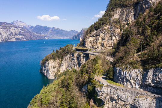 Coastal road along lake Lucerne in Canton Schwytz in Central Switzerland on a sunny summer day