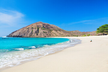 Beautiful view of turquoise water and white sand at tropical Mawun beach in Lombok, Indonesia 