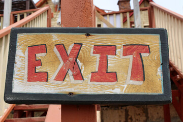 Exit sign with red lettering 