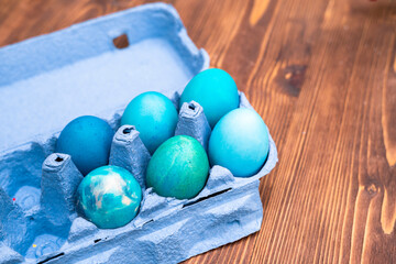 Colorful Easter eggs on wooden background