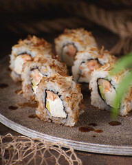 Asian rolls on brown background. Close-up