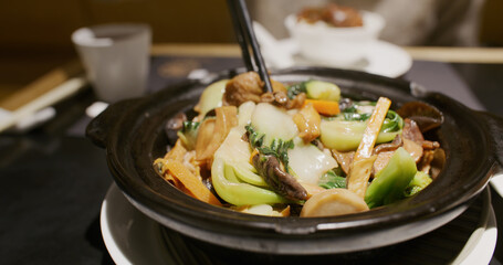 Catonese style vegan cuisine in bow, braised vegetables with red fermented beancurd