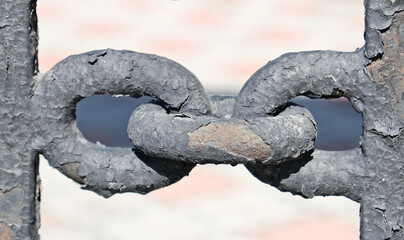 Metal crossbar in shape chain link ,rusty metal texture,  deep fracture of metal with peeling...