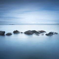 Rocks and soft sea, long exposure photography landscape.