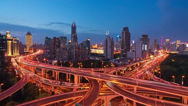 Time-lapse aerial view of busy highway at night during rush hour, congested highways, overpass on Yan'an East Road in Shanghai 