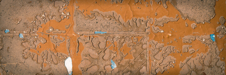 Rough brown wall texture with pieces of glue and stucco in place of old tile. Wide panoramic texture for background and design.